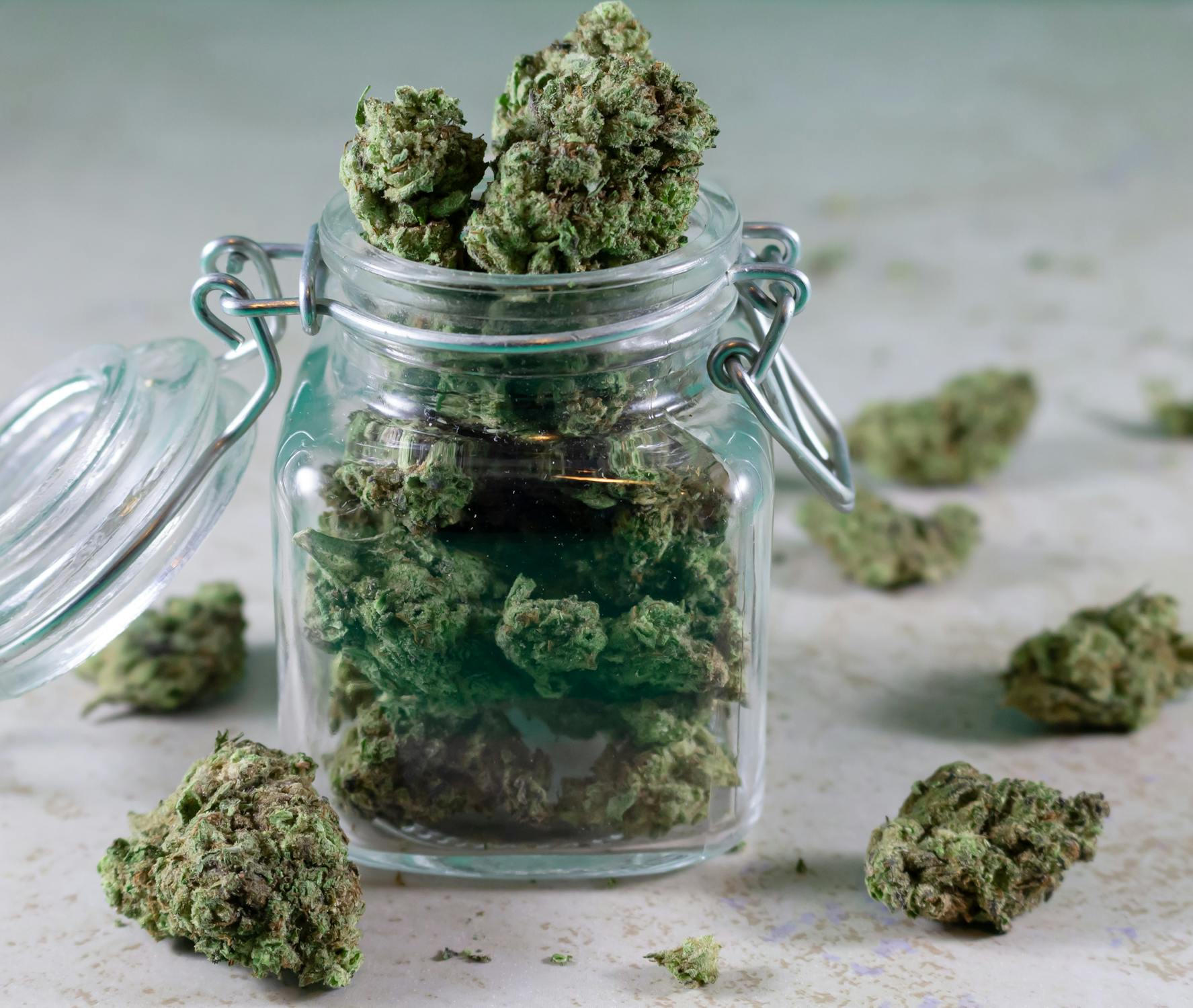 Cannabis in glass jar with precise measurement close-up
